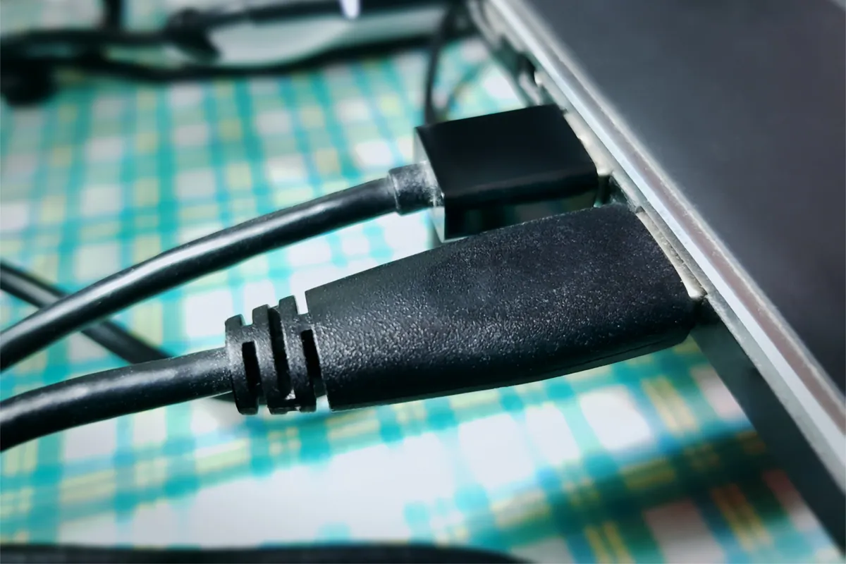 A USB cable connected to a laptop