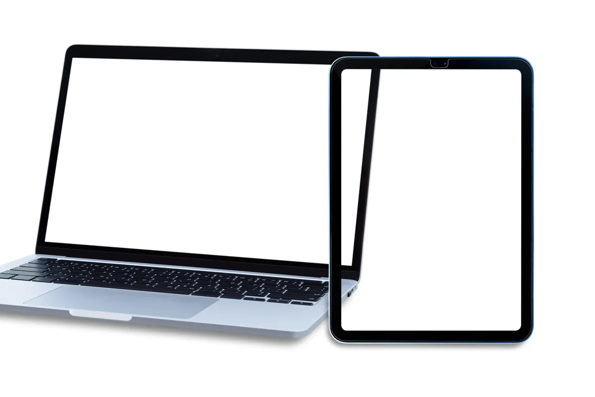 A laptop beside a second screen