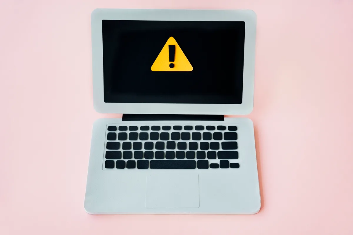 Laptop screen with visible flickering being examined for display fault