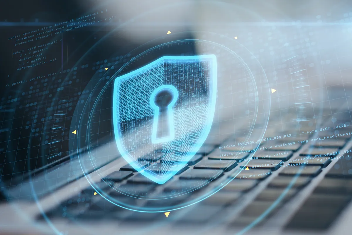 A laptop with a glowing keyhole security concept