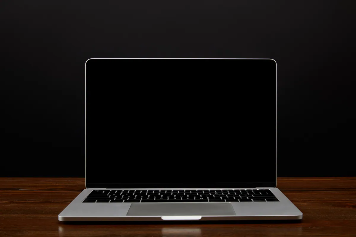 A laptop with a blank black screen that will not turn on