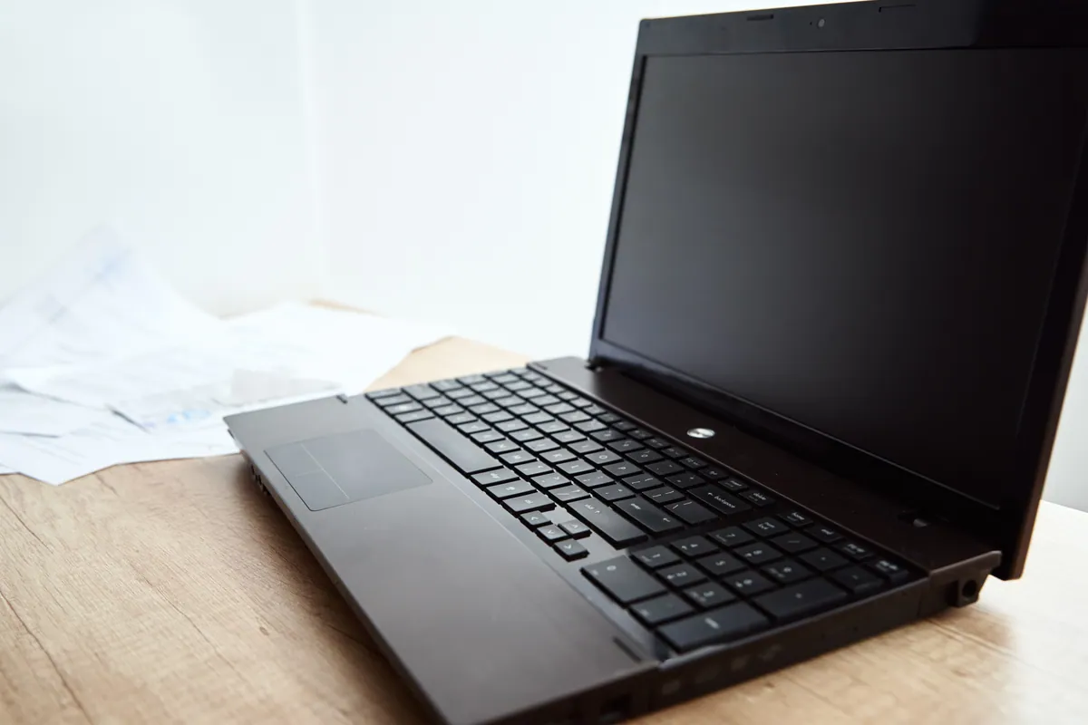 A laptop set up for work on a home-office desk