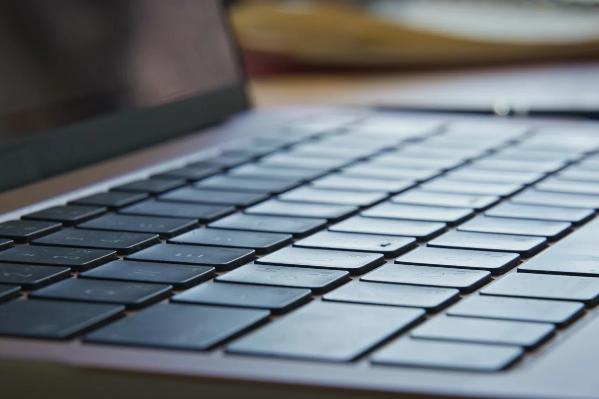 Close-up of laptop keyboard keys during keyboard repair case study