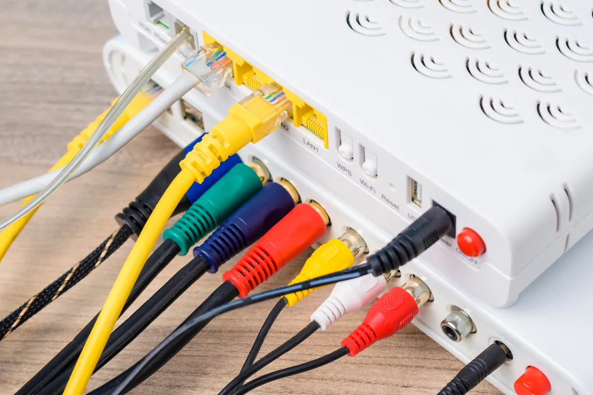 Network router with connected cables during Wi-Fi troubleshooting