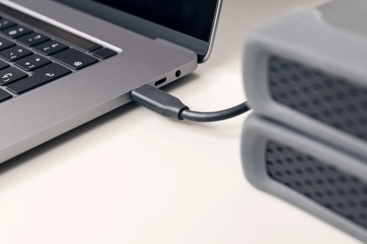 An external hard-disk cable connected to a computer for data recovery
