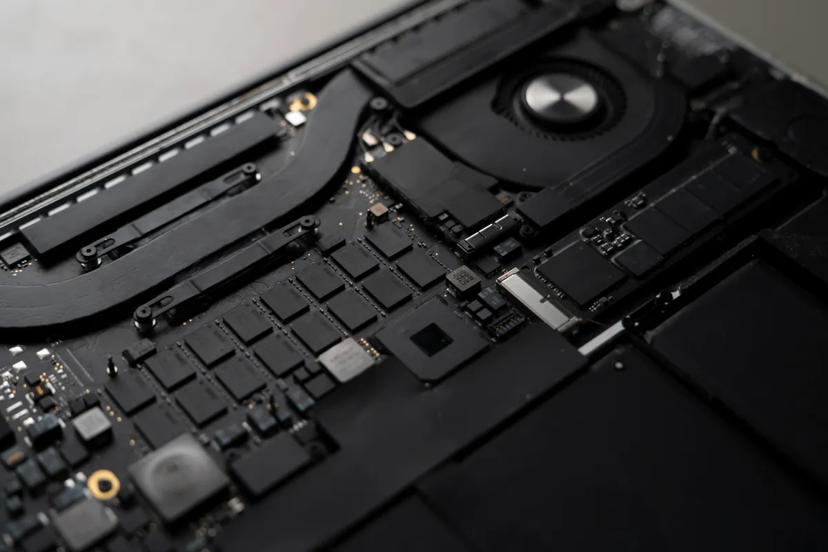 A disassembled laptop exposing its internal circuit boards