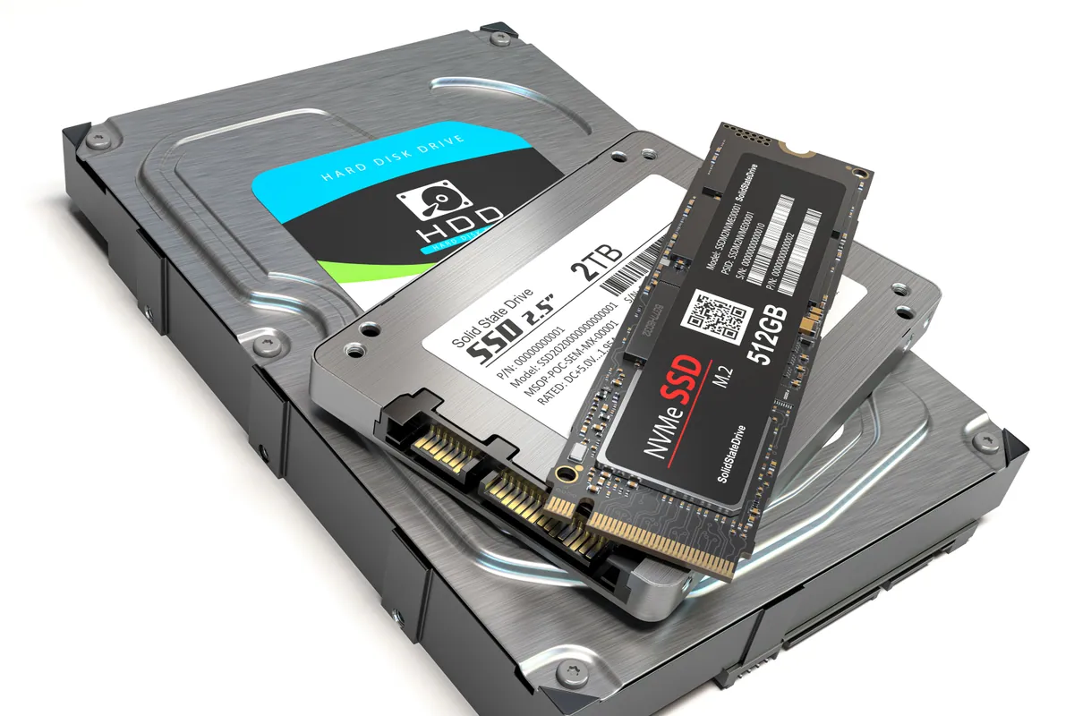 A solid-state drive next to the traditional hard drive it replaces